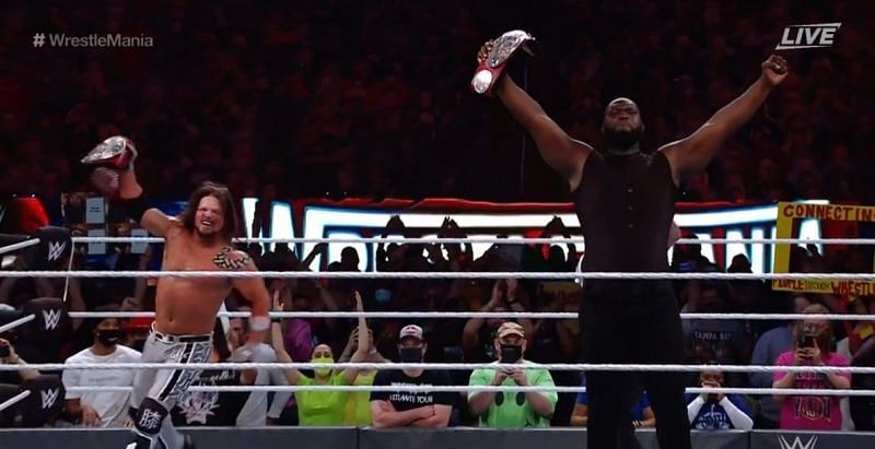 AJ Styles and Omos following their win at WrestleMania